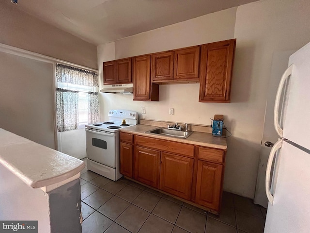 kitchen with sink, exhaust hood, light tile flooring, and white appliances