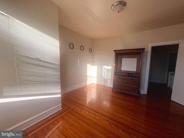 empty room with wood-type flooring