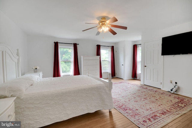 bedroom featuring ceiling fan and wood-type flooring