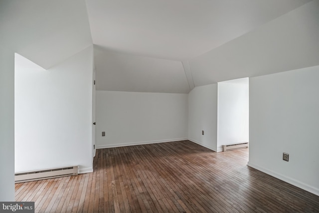 bonus room featuring a baseboard radiator, dark hardwood / wood-style floors, and vaulted ceiling