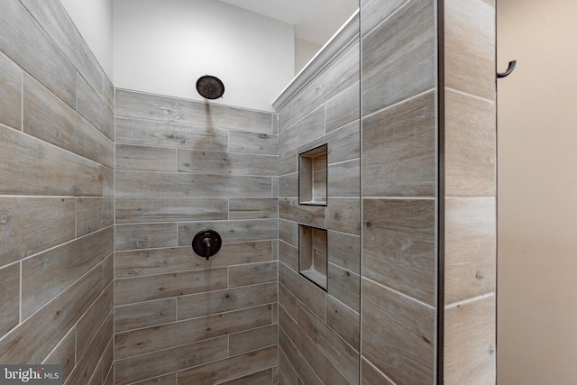 bathroom featuring tiled shower