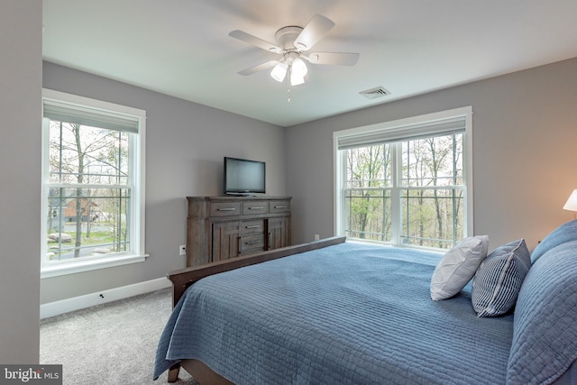 carpeted bedroom with ceiling fan