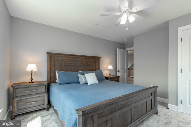 bedroom featuring light colored carpet and ceiling fan