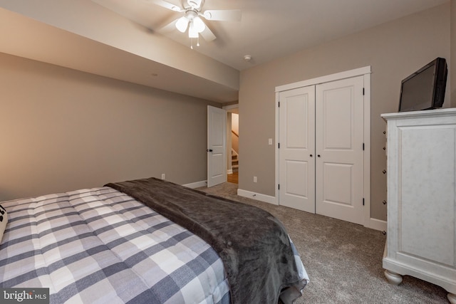 carpeted bedroom featuring a closet and ceiling fan