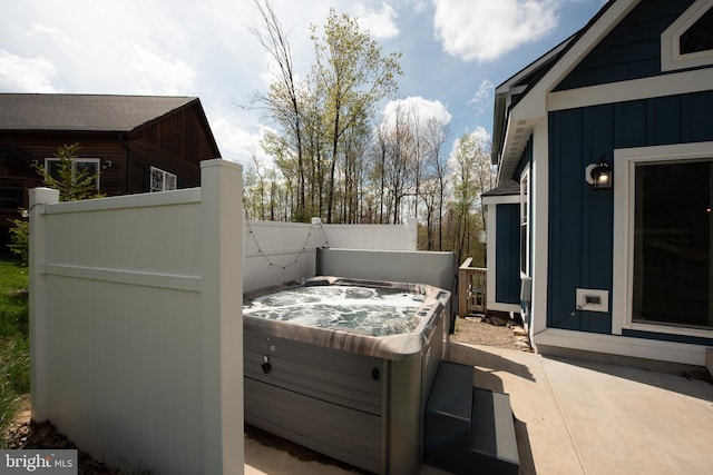 exterior space featuring a hot tub