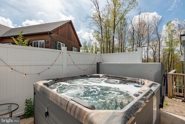 view of patio / terrace with a hot tub