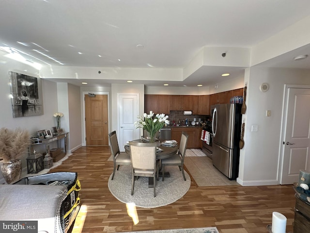 dining room with light hardwood / wood-style flooring