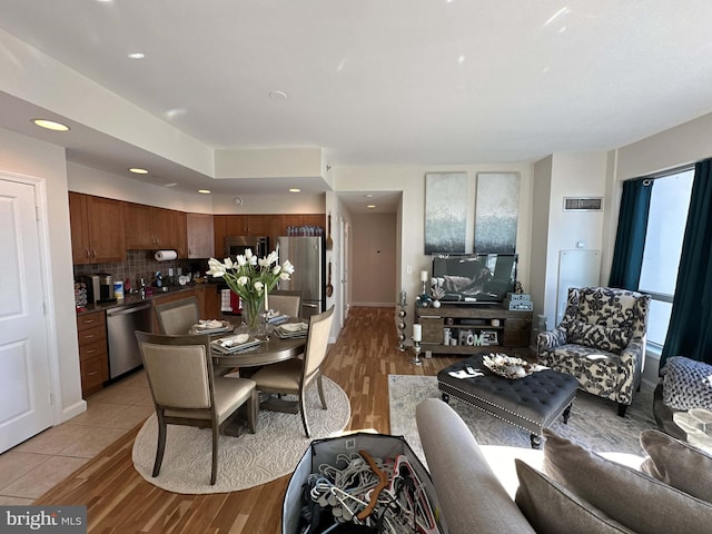 living room with tile flooring and sink