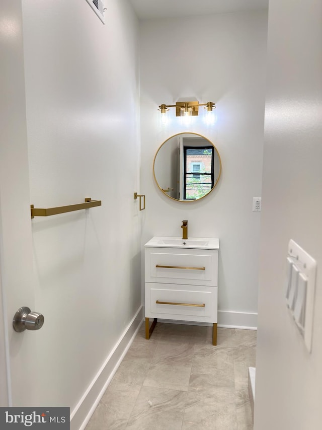 bathroom with tile patterned flooring and vanity