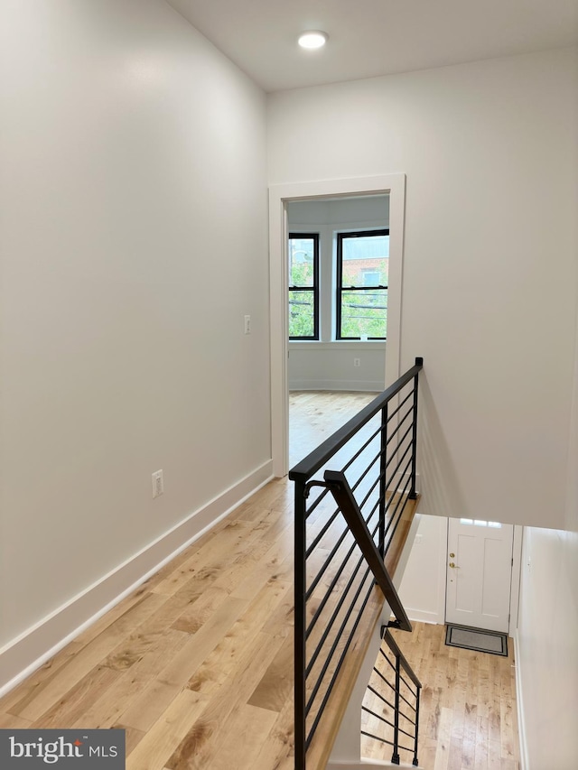 stairway featuring hardwood / wood-style flooring