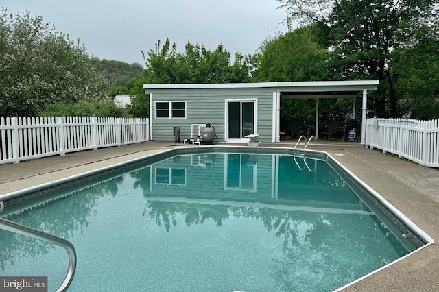 view of swimming pool featuring a patio area