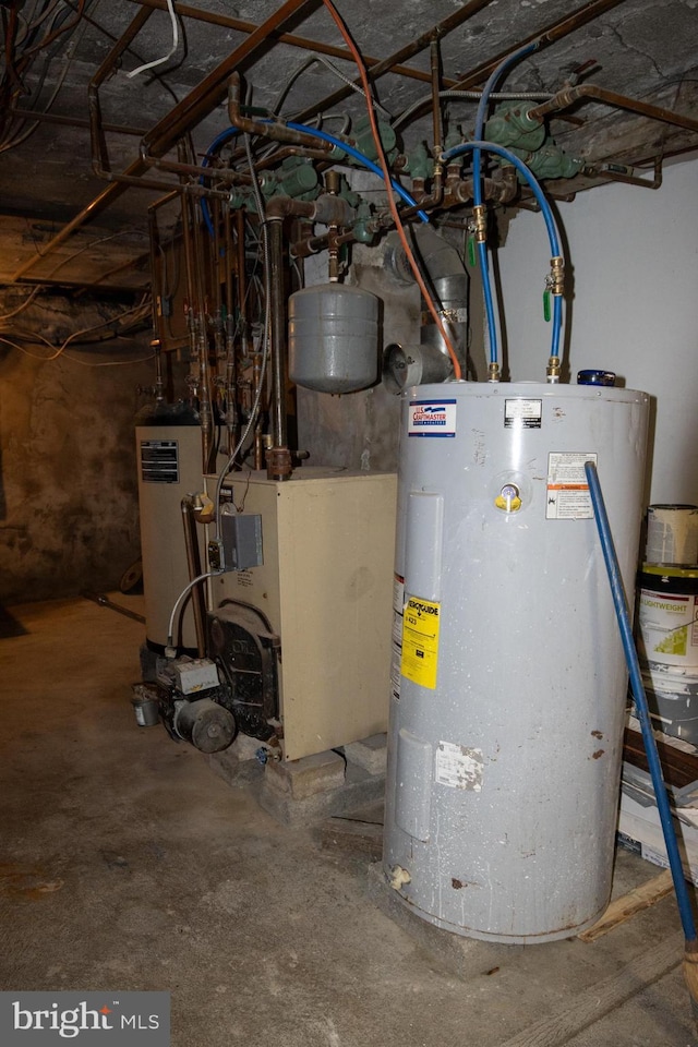 utility room featuring water heater