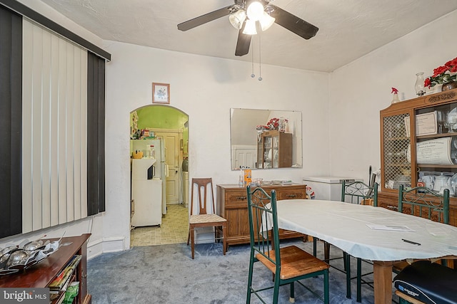 dining room with carpet and ceiling fan