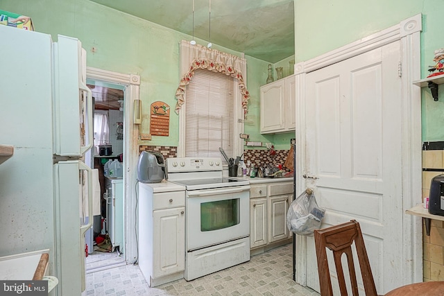 kitchen featuring white electric range oven, white cabinetry, and light tile floors