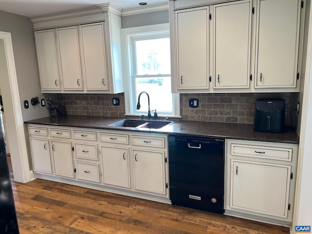 kitchen featuring sink, dark hardwood / wood-style floors, tasteful backsplash, and dishwasher