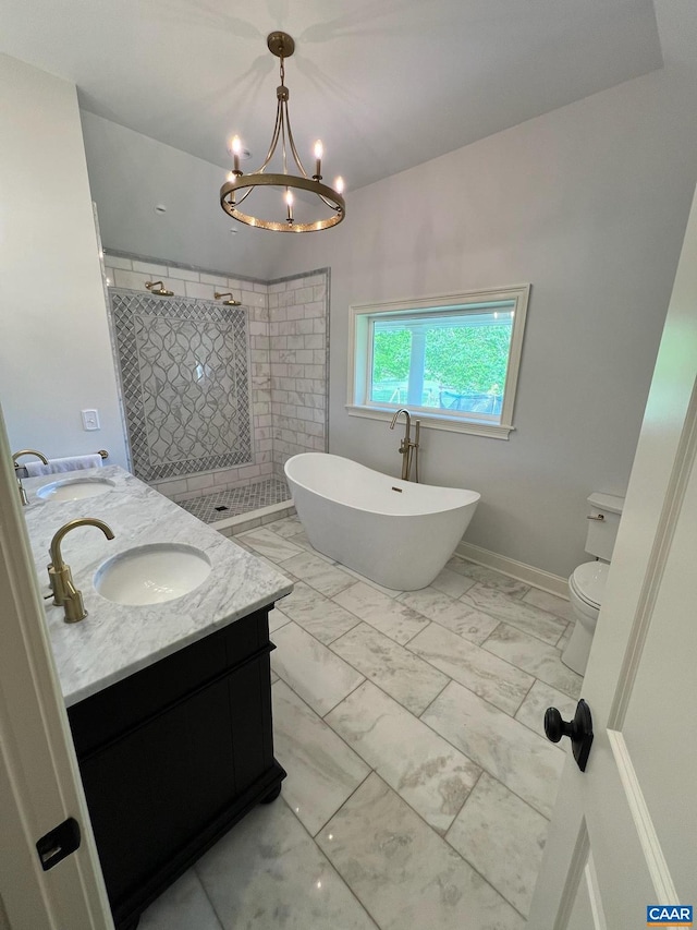 bathroom featuring double vanity, toilet, tile flooring, tiled shower, and a chandelier