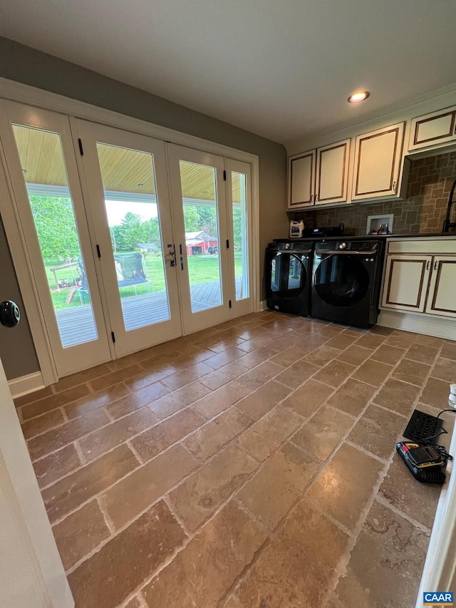 kitchen featuring independent washer and dryer, tasteful backsplash, cream cabinets, and french doors