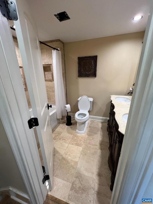 full bathroom featuring toilet, vanity, shower / bath combo, and tile floors