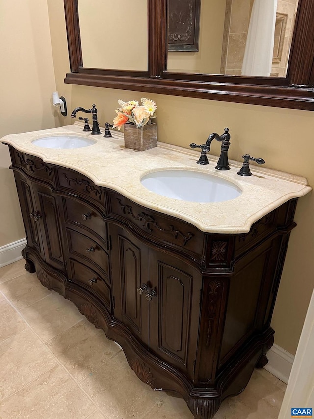 bathroom featuring tile floors and double vanity