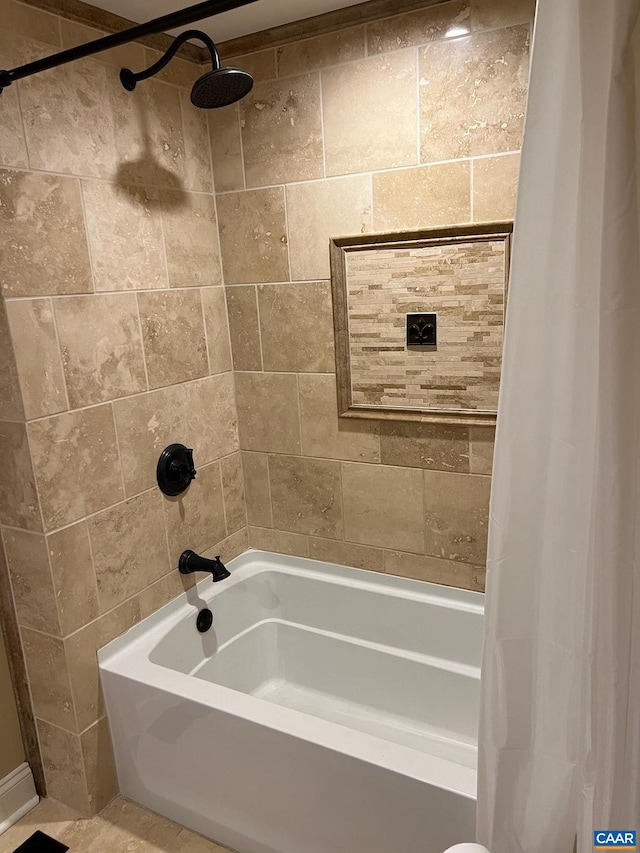 bathroom featuring shower / bath combo with shower curtain