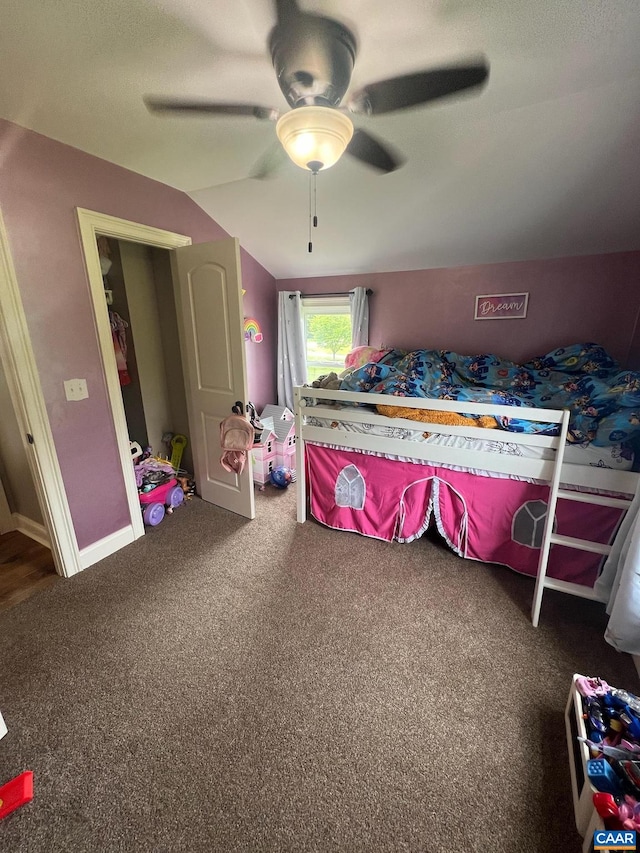 carpeted bedroom featuring ceiling fan and lofted ceiling