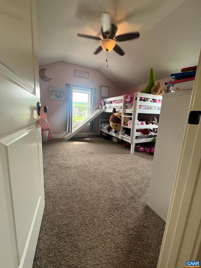 carpeted bedroom with ceiling fan and lofted ceiling