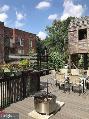 wooden deck with a fire pit