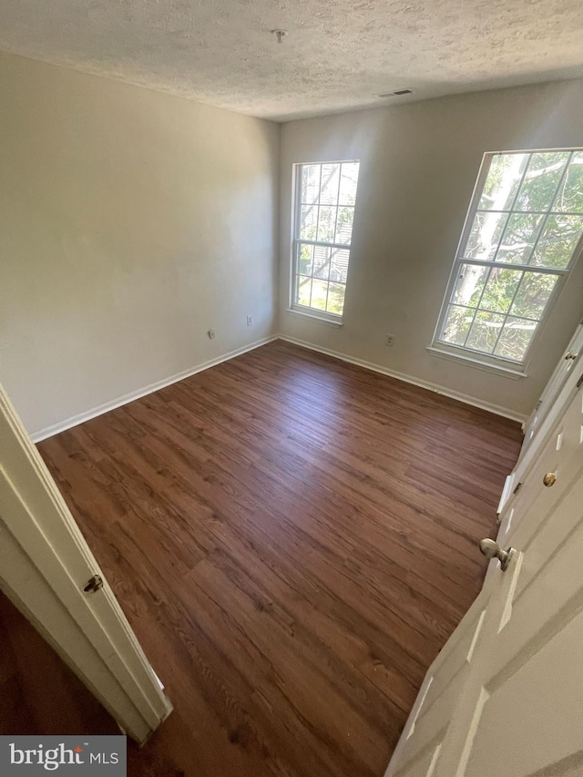 904 Swallow Crest Ct Unit 904-M, Edgewood, MD 21040 - empty room featuring dark wood-type flooring and a textured ceiling