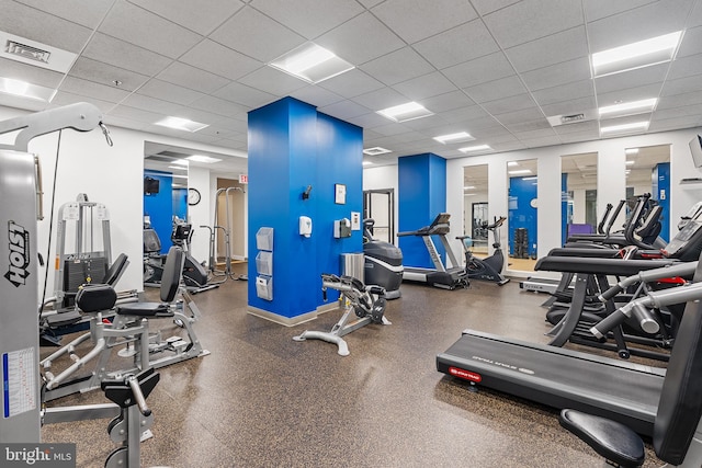 gym featuring a paneled ceiling