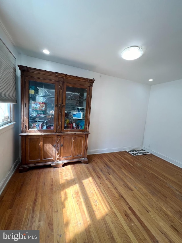 unfurnished room featuring wood-type flooring