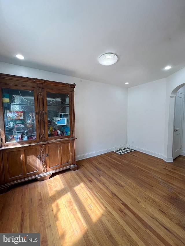 spare room with hardwood / wood-style floors