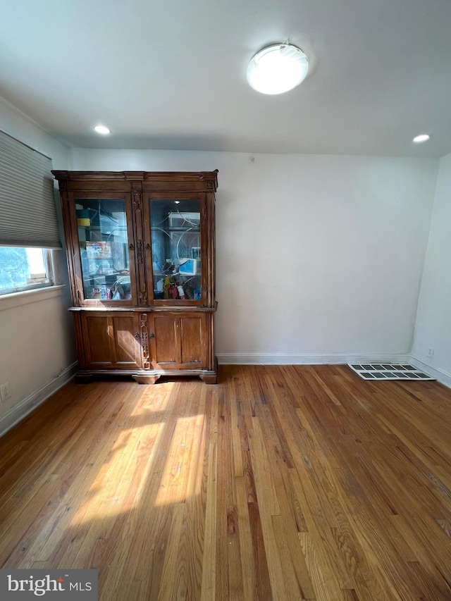 empty room featuring hardwood / wood-style flooring