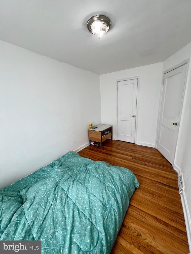 bedroom featuring wood-type flooring