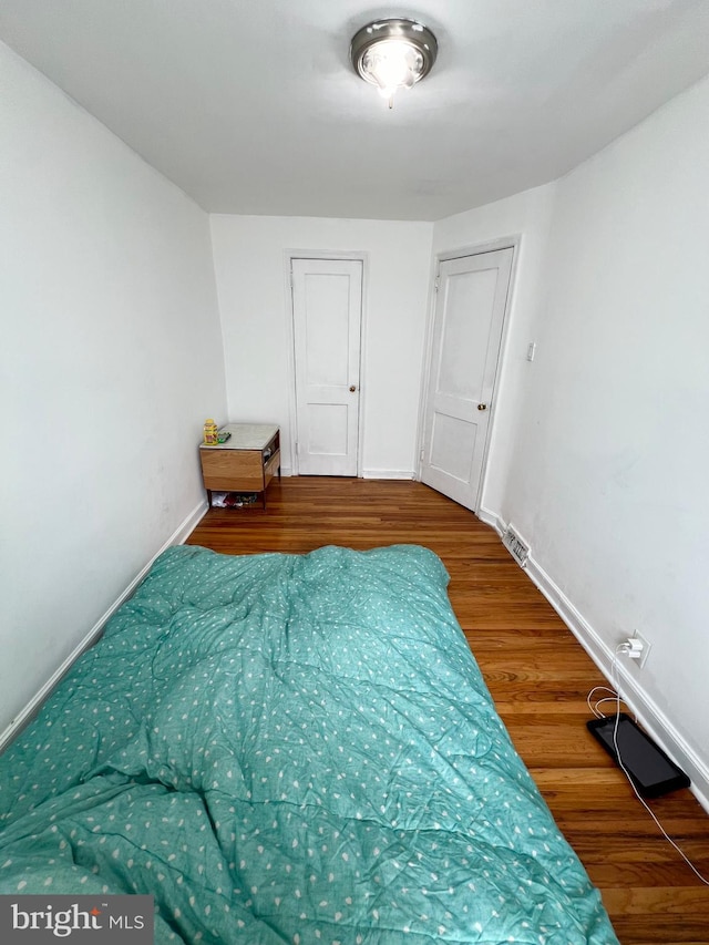 bedroom featuring hardwood / wood-style flooring