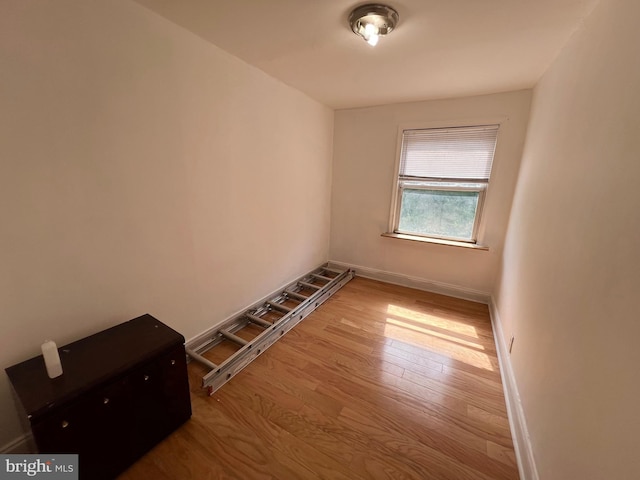 spare room featuring light hardwood / wood-style flooring