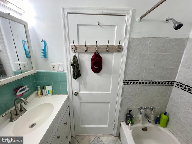 bathroom featuring tile floors, oversized vanity, and tile walls