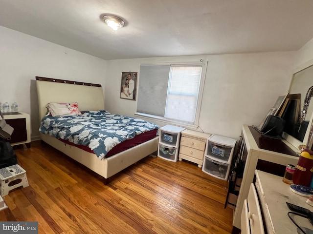 bedroom featuring wood-type flooring