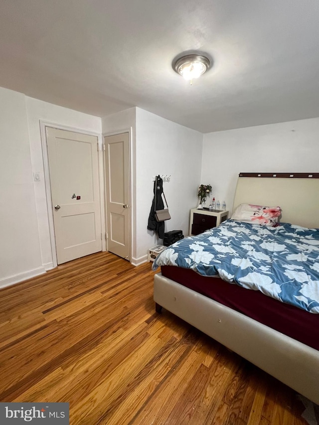 bedroom with wood-type flooring