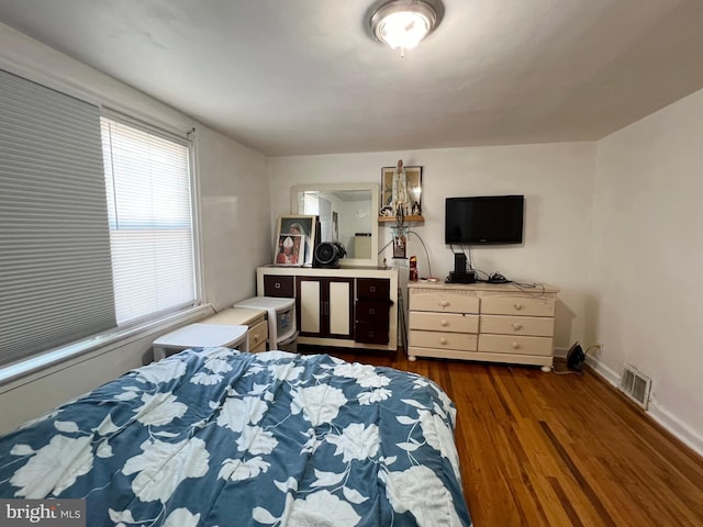 bedroom featuring dark wood-type flooring