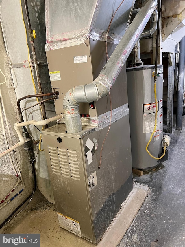 utility room featuring water heater