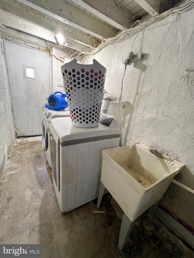 laundry area with washing machine and dryer