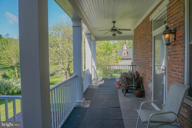 balcony featuring ceiling fan and a porch