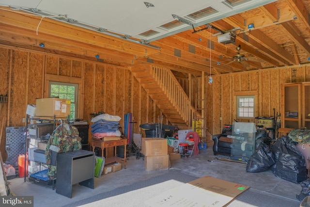 garage featuring ceiling fan and a garage door opener