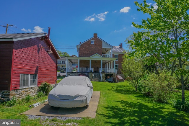 view of front of house with covered porch and a front yard