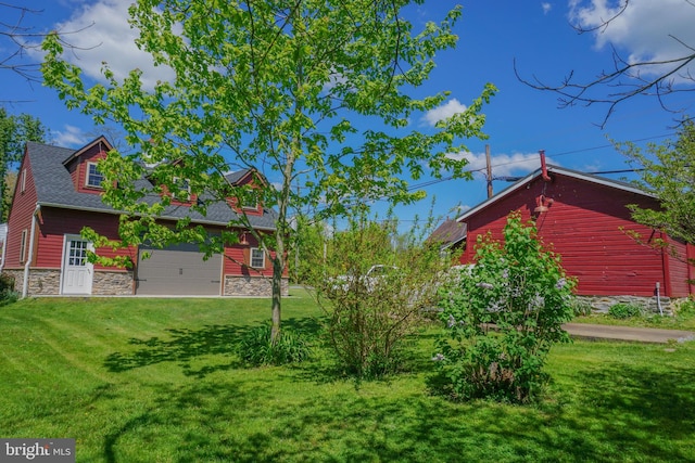 view of yard featuring a garage