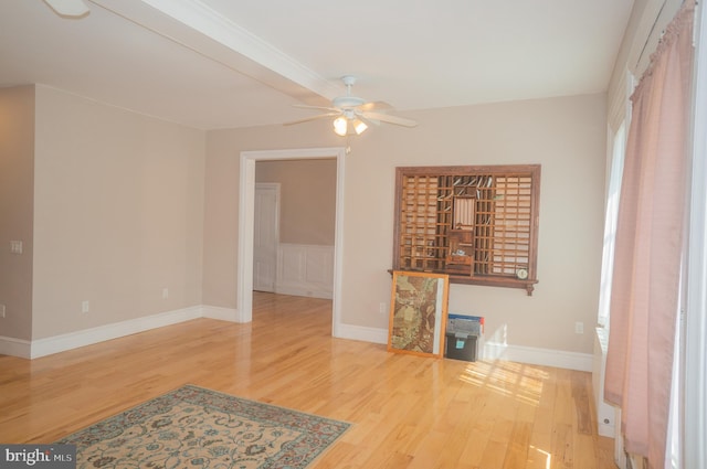 unfurnished living room featuring ceiling fan and wood-type flooring