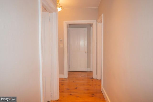 hall with light wood-type flooring