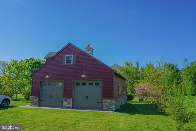 garage featuring a yard