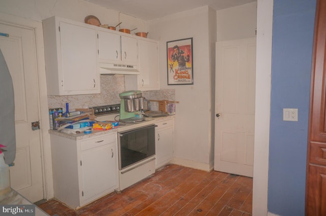 kitchen with tasteful backsplash, ventilation hood, white range with electric stovetop, hardwood / wood-style floors, and white cabinets