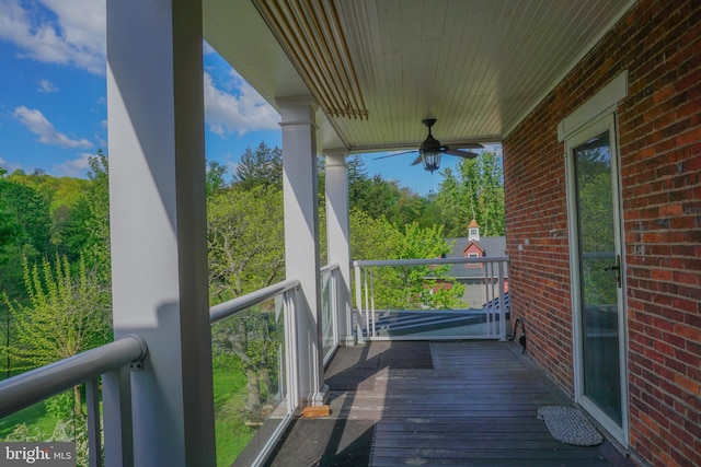 wooden terrace with ceiling fan